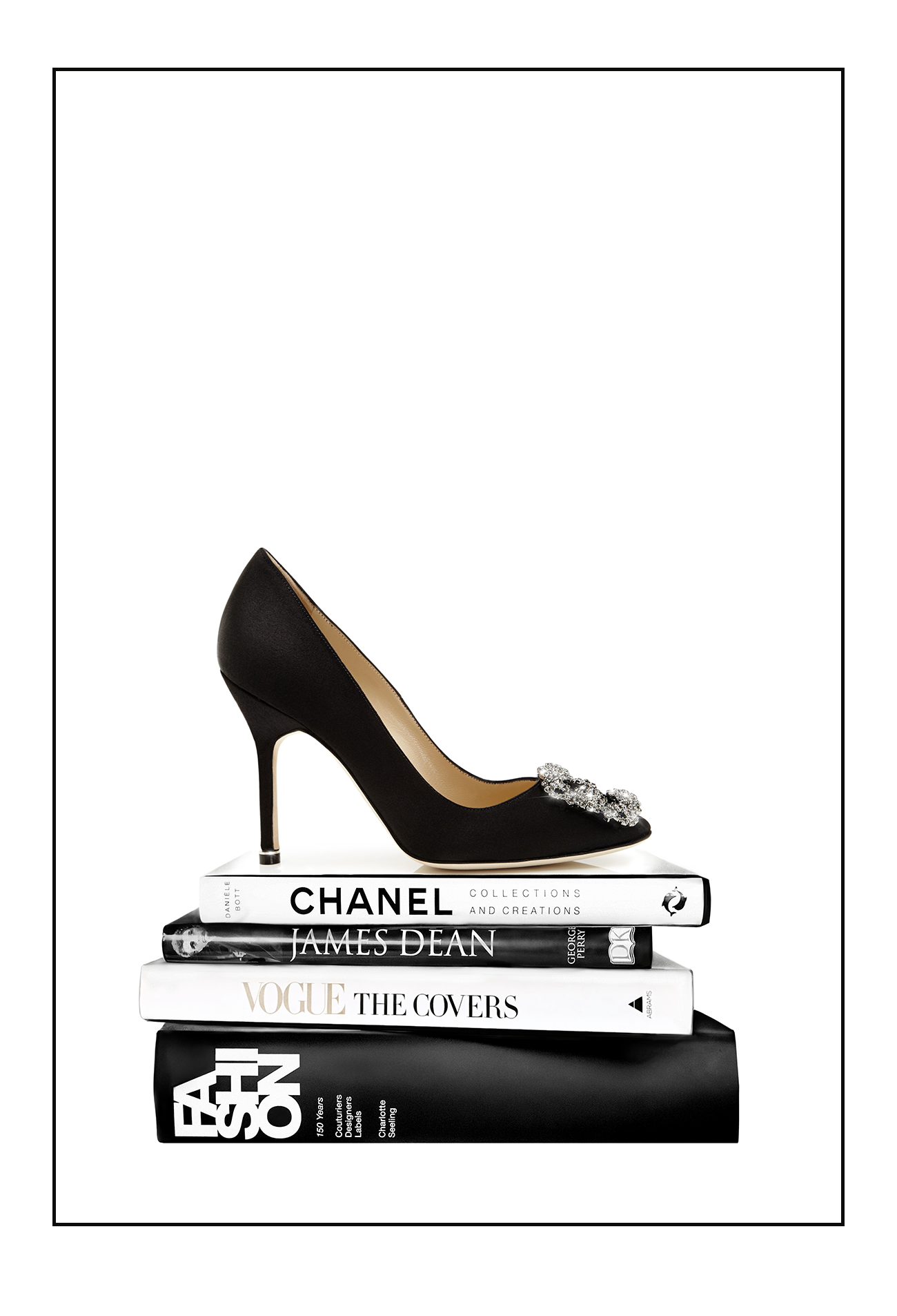 Portrait print with black and white books and high heel on the top; of the book stack