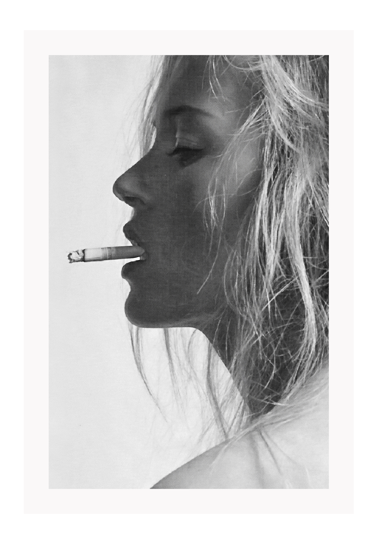 A black and white fashion photographic wall art with iconic 90s model Kate Moss smoking cigarette.