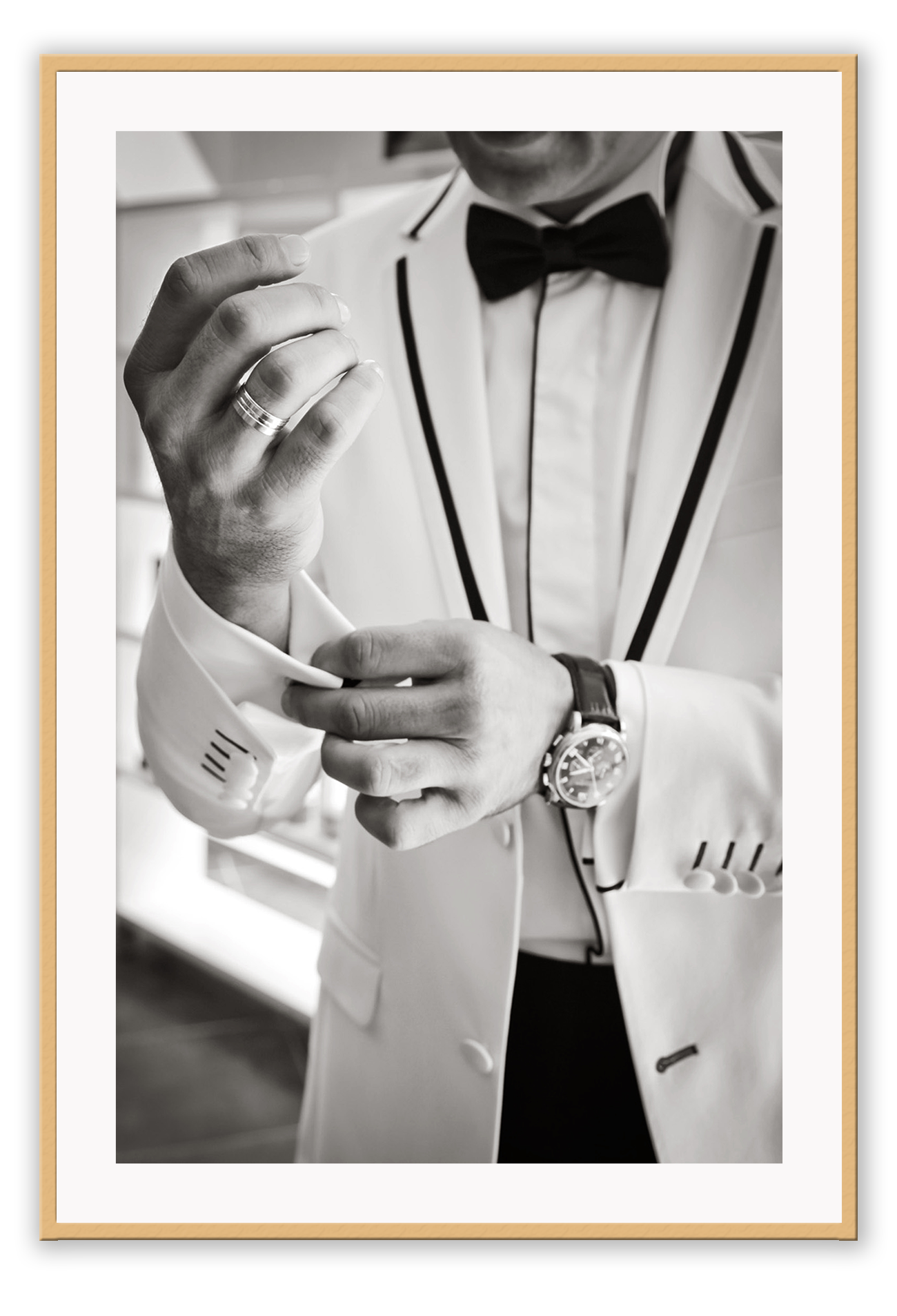 Photography fashion print man adjusting cufflinks on white suit jacket with expensive watch and bow tie
