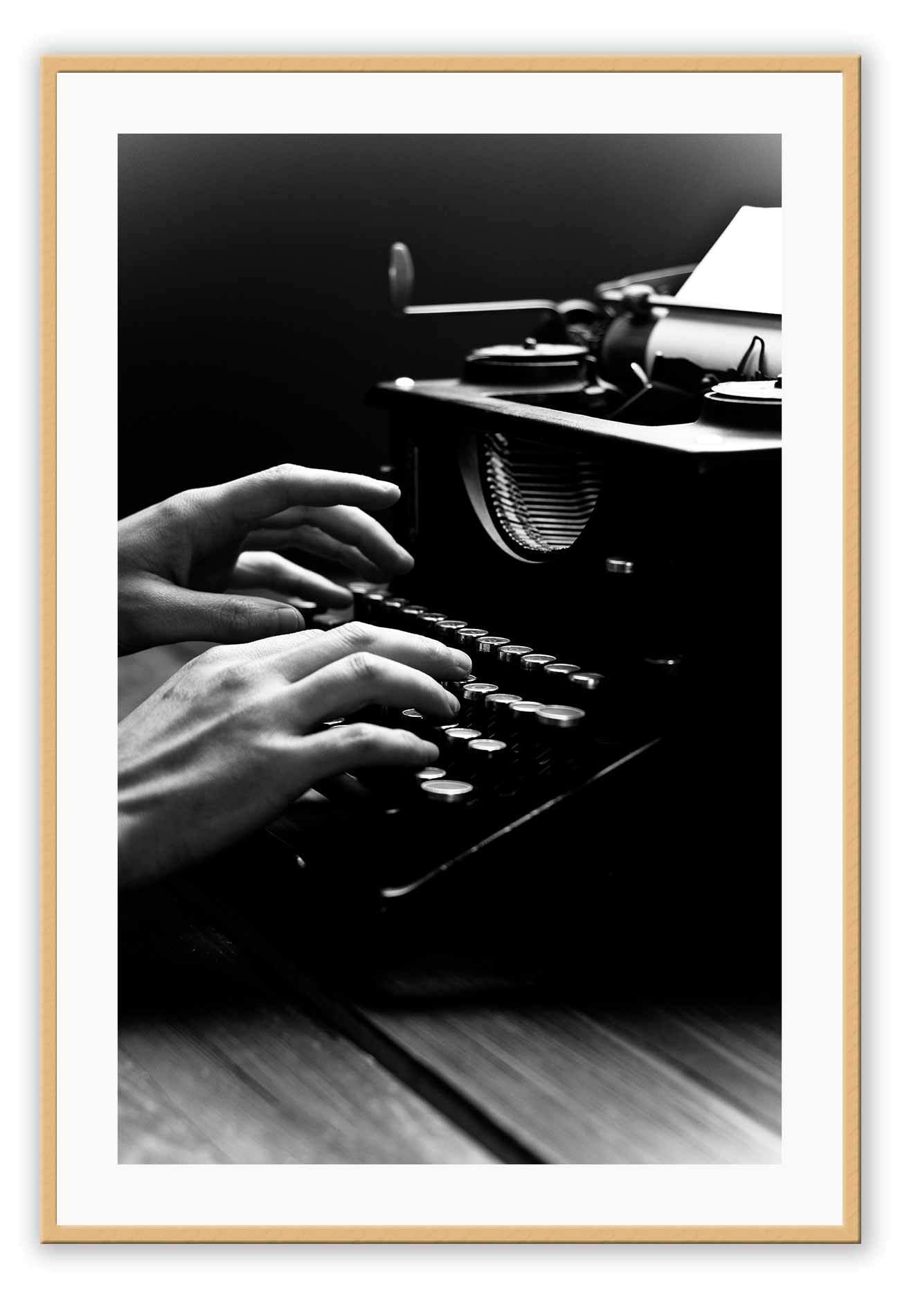 A vintage black and white wall art of a vintage type writer.