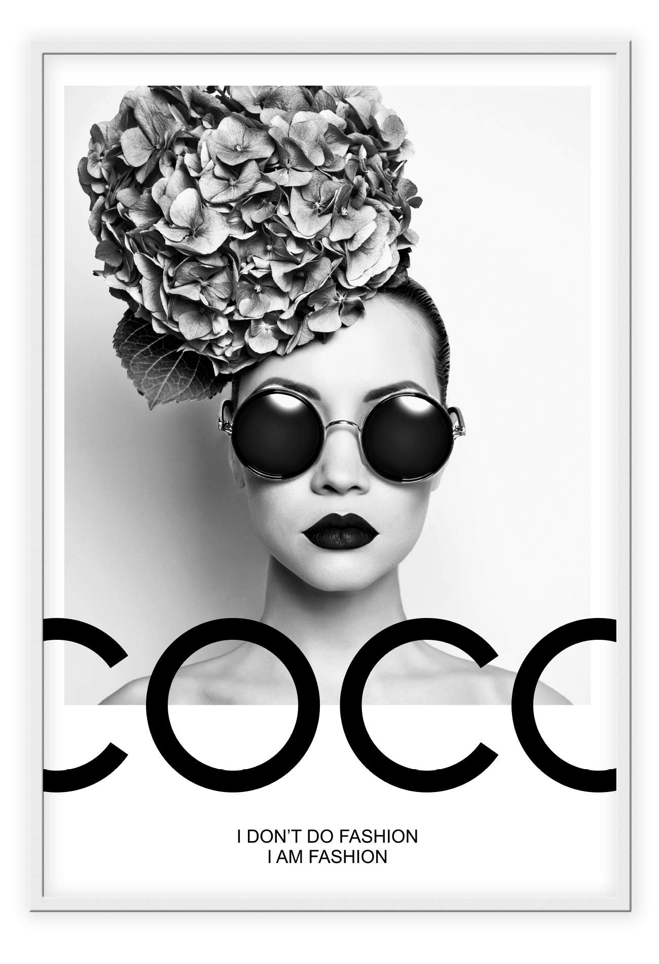 A black and white fashion photographic wall art of a lady holding balloon leaning on a scandi bike, riding on the writing coco chanel I don't do fashion I am fashion.
