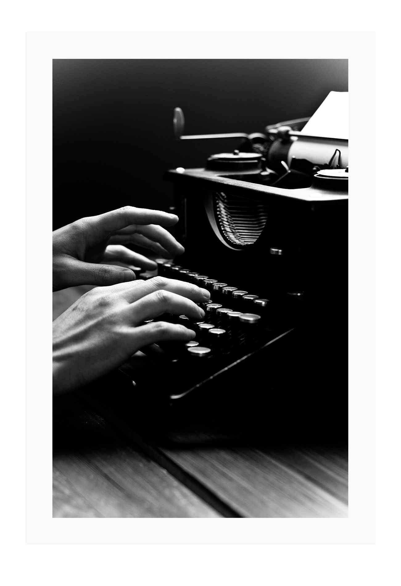 A vintage black and white wall art of a vintage type writer.