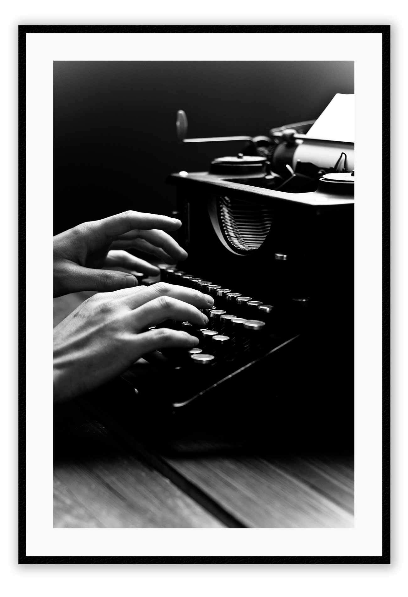 A vintage black and white wall art of a vintage type writer.