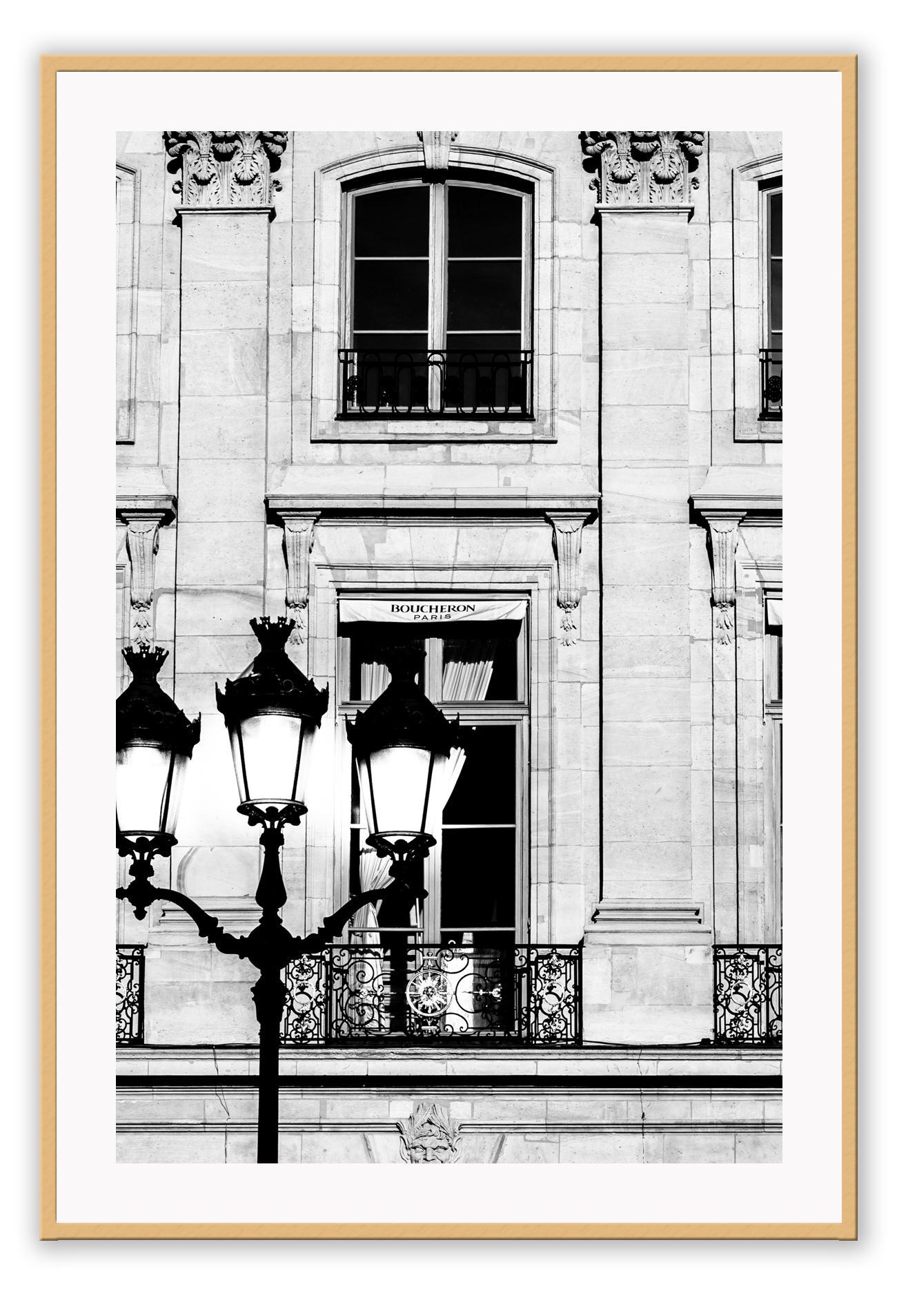 A black and white fashion photography print in paris with street lamp and architechture
