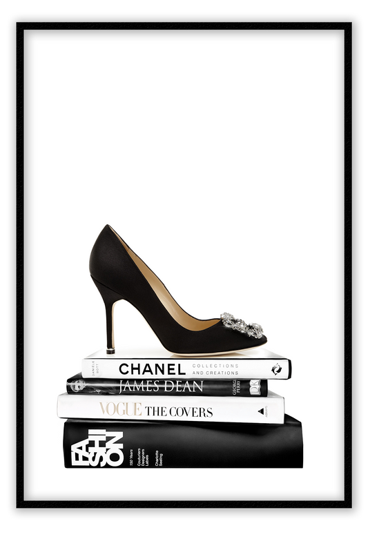 Portrait print with black and white books and high heel on the top; of the book stack