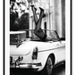Fashion photography with womans legs coming out of a vintage car black and white lingerie sexy  