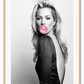 An iconic fashion wall art with 90s English model Kate Moss and pink bubble gum.