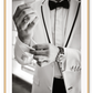 Photography fashion print man adjusting cufflinks on white suit jacket with expensive watch and bow tie 