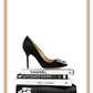 Portrait print with black and white books and high heel on the top; of the book stack