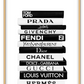 Stack of black and white books fashion photography iconic designers prada dior hermes louis vuitton