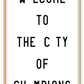 A black and white fashion scandi typography wall art with black writing  welcome to the city of Champions