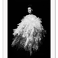 Fashion print with woman in white dress floating on a black background  
