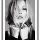 A black and white Portrait of famous celebrity model Kate Moss in leather jacket biker girl woman dark makeup blonde hair 