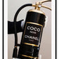 Gold, black and white fire fashion extinguisher with Chanel logo and hand with glove holding