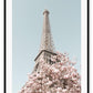 Eiffel tower Paris print with pink cherry blossoms and blue sky, pastel colours and dynamic view 