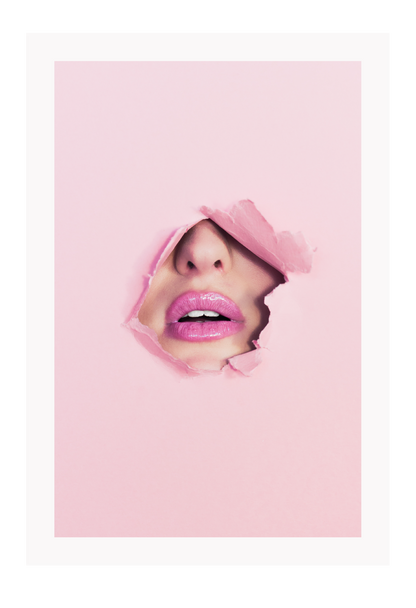A pink wall art with fashion model face and pink lips. 