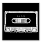 A vintage fashion wall art with Gucci fashion label on 80s 90s vintage cassette tape in fluro black and white inverted colour.