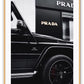 Fashion black and white photography print of a black Mercedes G Wagon in front of a Prada store.