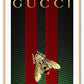 Print with Gucci logo and a bee in gold in the centre on a green and black checkered background with two vertical red stripes
