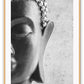 Photography print of black and white buddha half of face with textured grey background