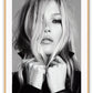 A black and white Portrait of famous celebrity model Kate Moss in leather jacket biker girl woman dark makeup blonde hair 