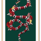 Fashion print with the red, black, green, and white Gucci snake on a green background with flowers surrounding. 