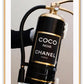 Gold, black and white fire fashion extinguisher with Chanel logo and hand with glove holding