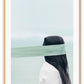 Photography of woman by the ocean wearing a blindfold with light blue tones and dark brown hair 