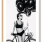 A fashion black and white wall art with a lady in lingerie holding balloons