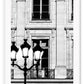 A black and white fashion photography print in paris with street lamp and architechture 