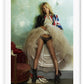 Fashion photography print featuring kate moss in a union jack jacket and hoop skirt lifing it up on a green wall background.