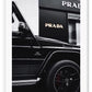 Fashion black and white photography print of a black Mercedes G Wagon in front of a Prada store.